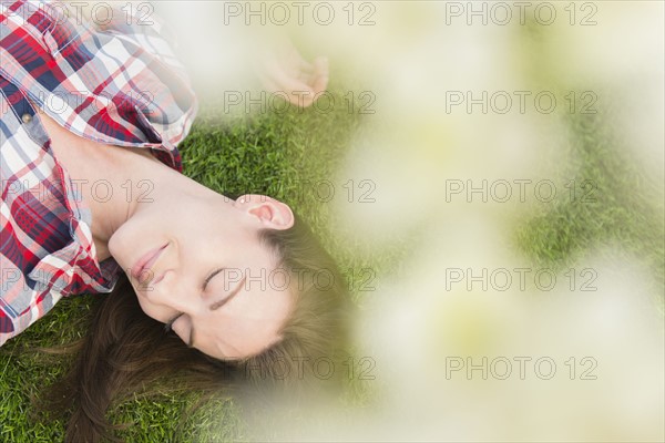 Woman lying on grass