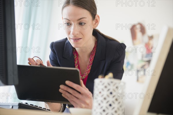 Woman using tablet in office