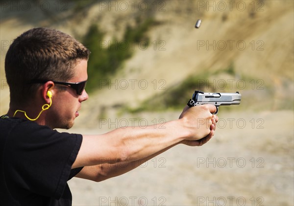 Man shooting handgun