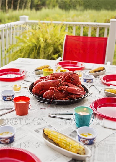 Plate with lobsters on dining table