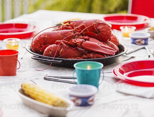 Plate with lobsters on dining table