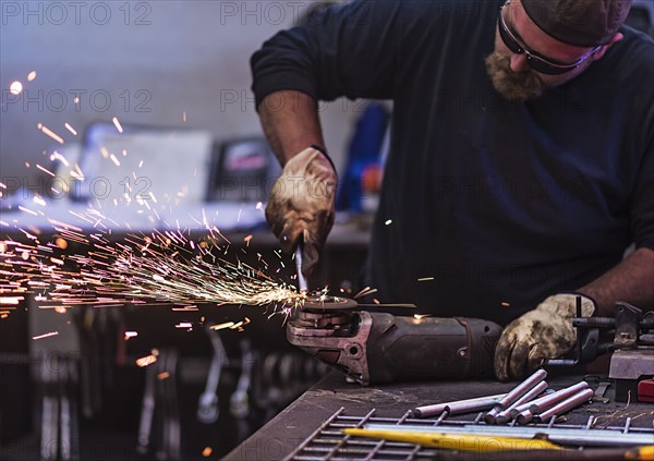 Man using circular saw in workshop