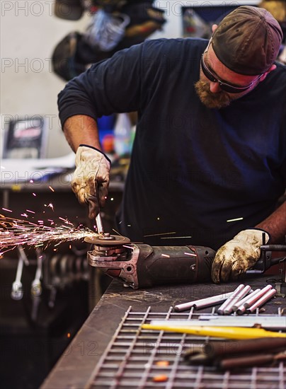 Man using circular saw in workshop