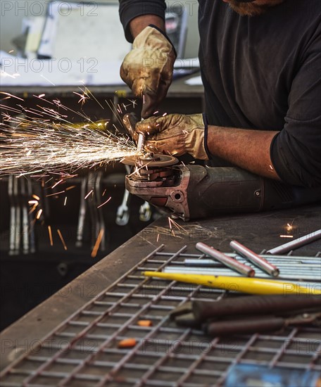 Man using circular saw in workshop