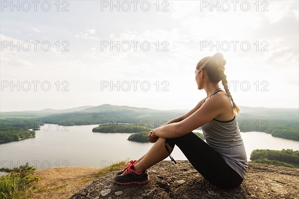 Young female hiker looking at view
