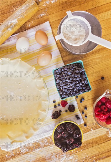 Ingredients for berry pie on table