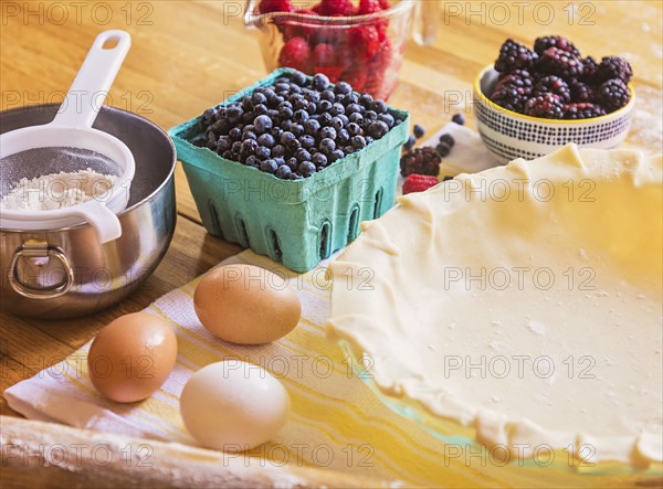 Ingredients for berry pie on table