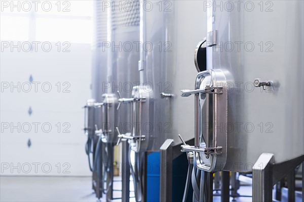 Stainless steel tanks in winery cellar