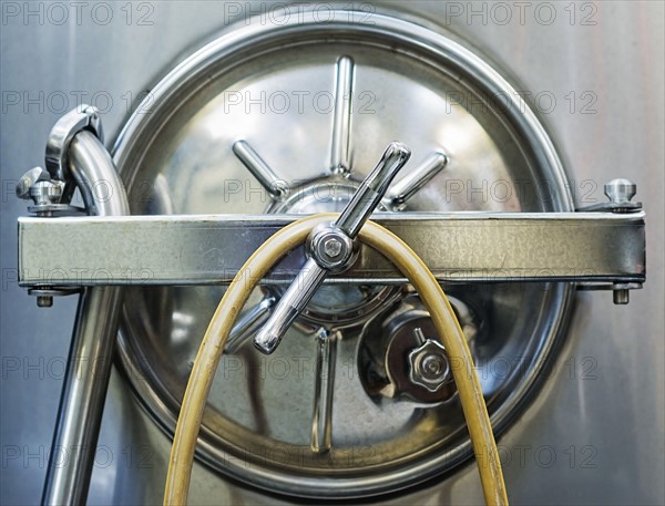 Close up of stainless steel tank in winery cellar