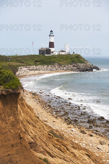 Lighthouse on cliff over sea