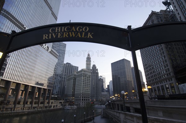 Sign on Chicago Riverwalk against sky