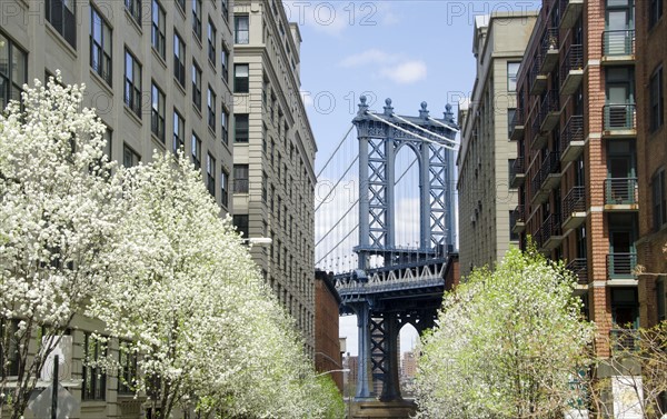 Manhattan Bridge seen between residential buildings