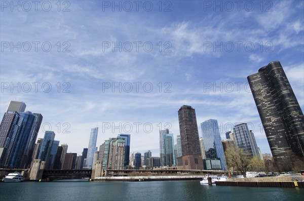 Waterfront cityscape under blue sky