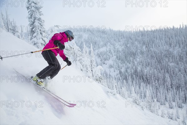 Woman skiing downhill