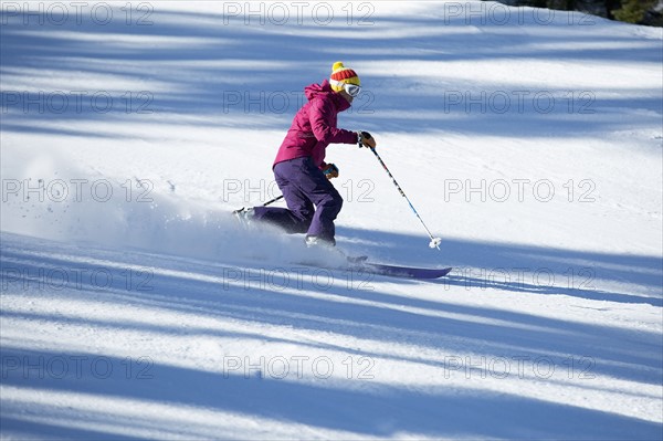 Woman skiing downhill