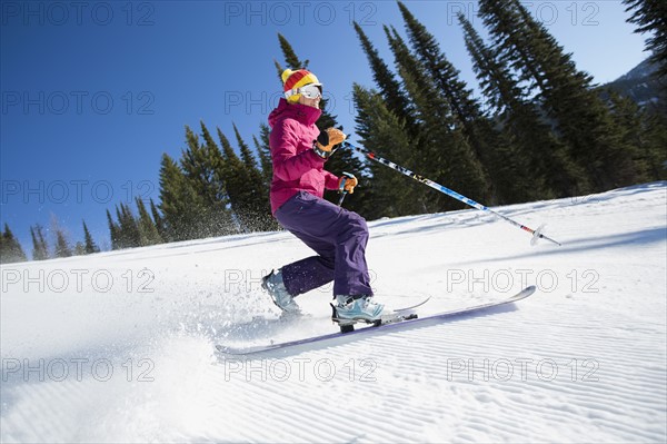 Woman skiing downhill