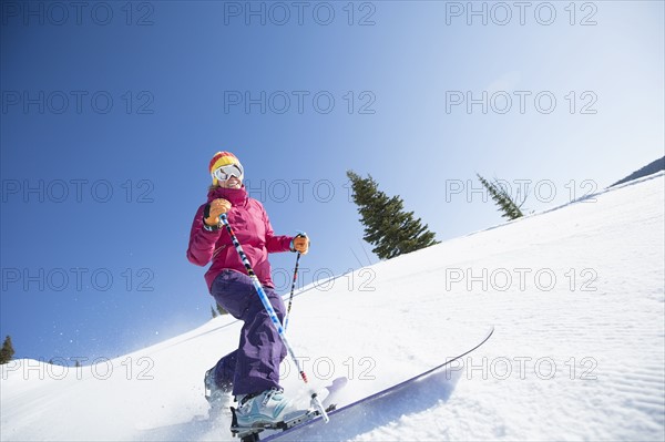 Woman skiing downhill