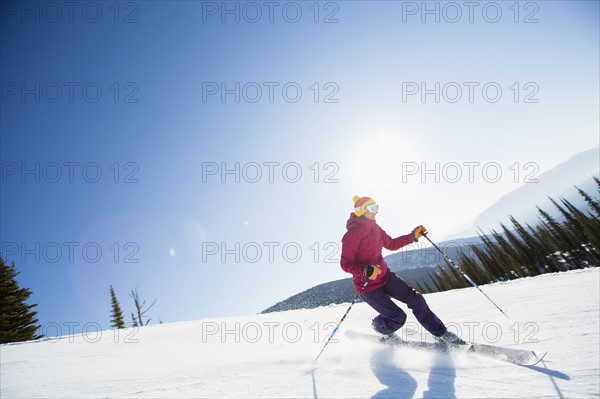 Woman skiing downhill