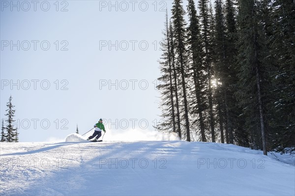 Man skiing downhill