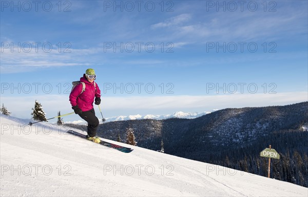 Woman skiing downhill