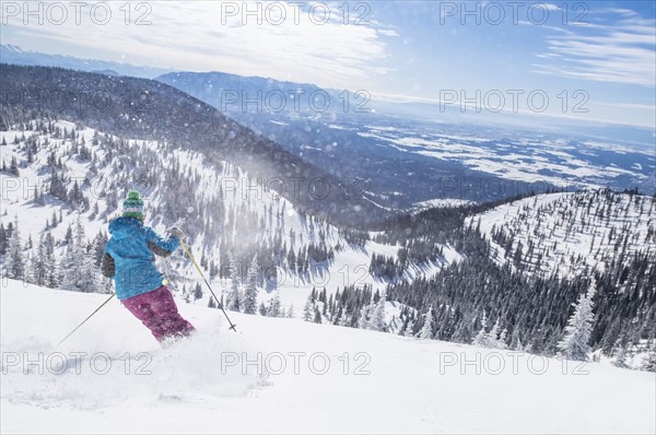 Woman skiing downhill