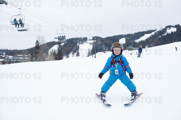 Smiley little boy (5) at ski resort