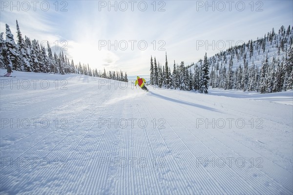 Young man speeding on ski slope