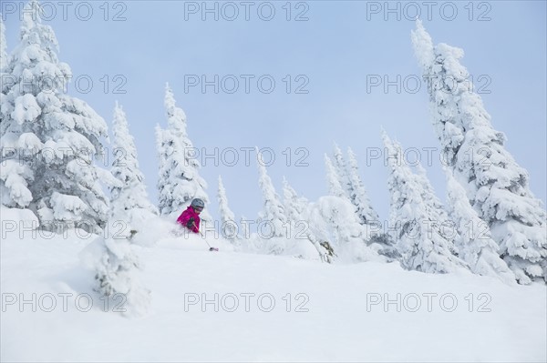 Low angle view of mature woman on ski slope