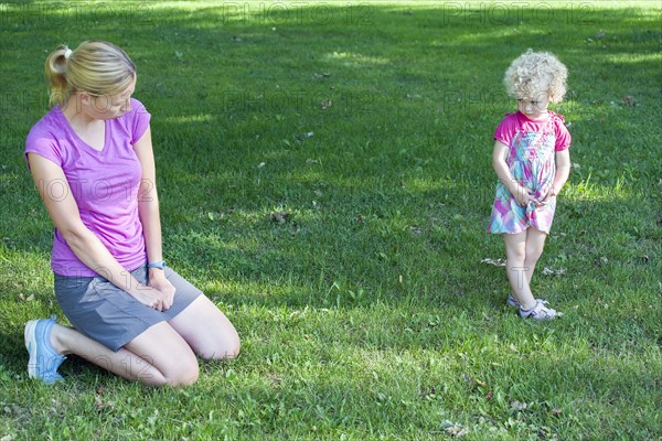 Mother copying daughter's (4-5) facial expression