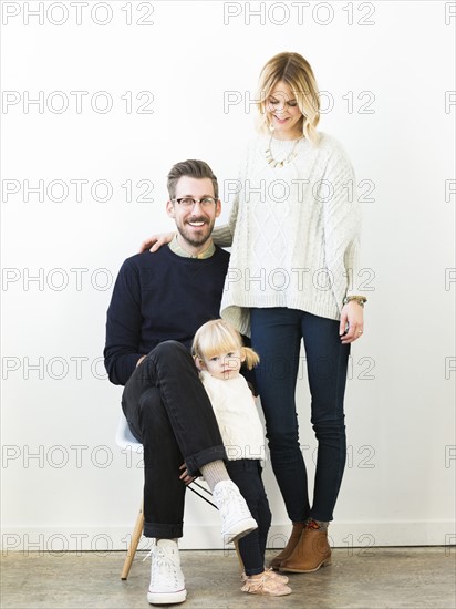 Portrait of cute girl (2-3) with parents