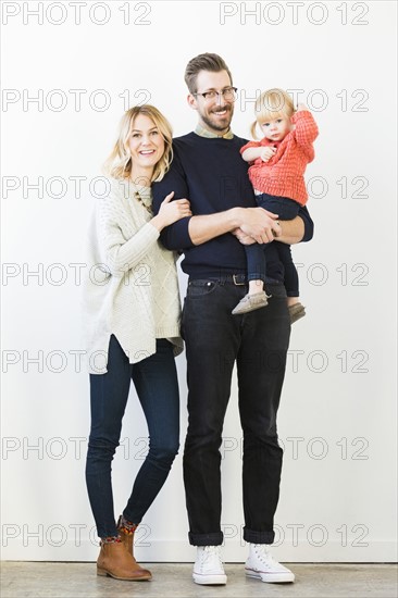 Portrait of cute girl (2-3) with parents