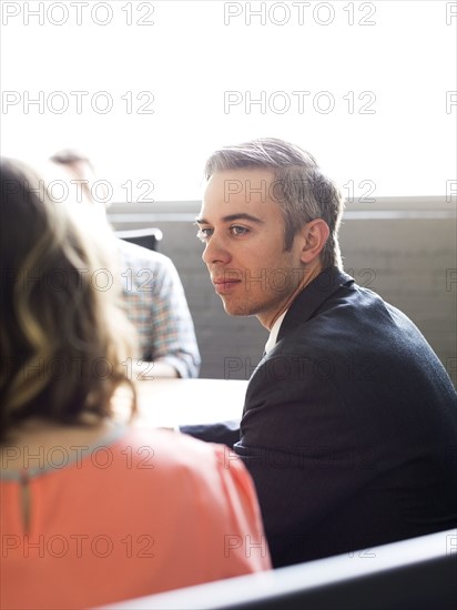 Three office workers during meeting