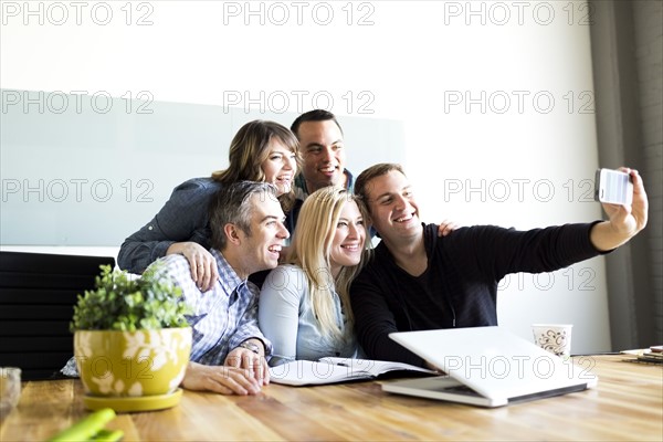 Office workers taking selfie