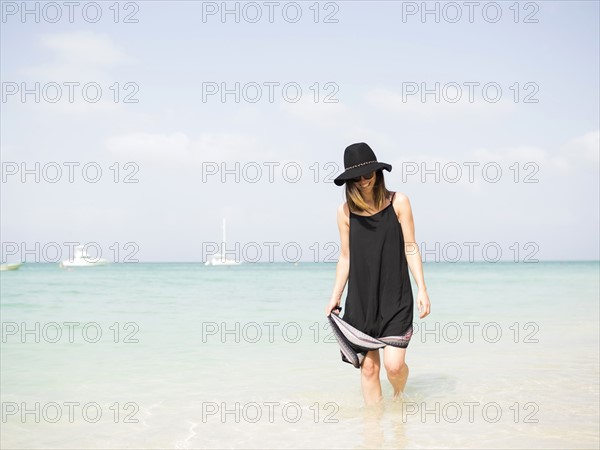 Woman walking on beach