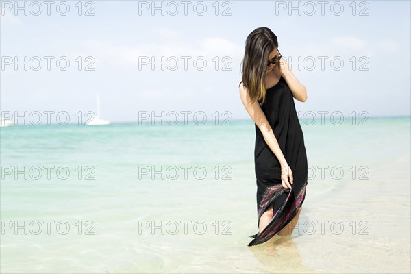 Woman walking on beach