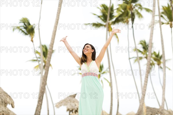 Woman in dress on beach