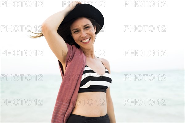 Woman in bikini relaxing on beach