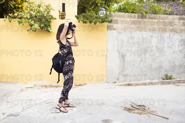 Woman taking photos during vacations