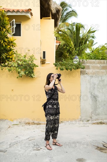 Woman taking photos during vacations