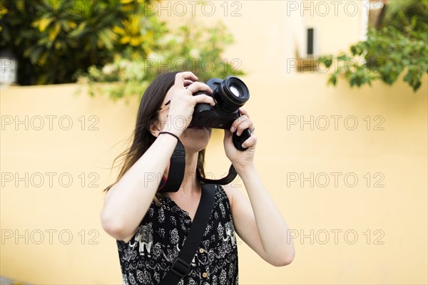 Woman taking photos during vacations