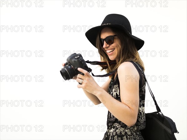 Woman taking photos during vacations