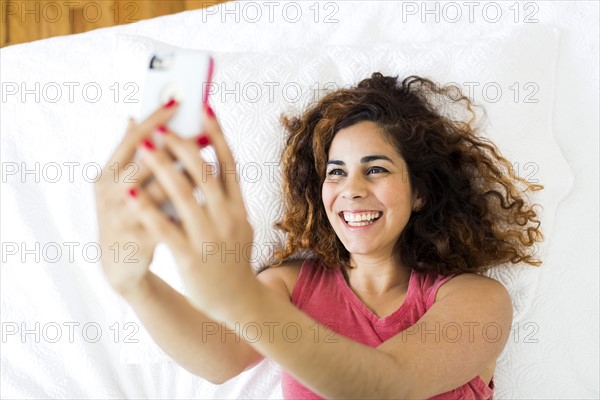 Woman holding smart phone