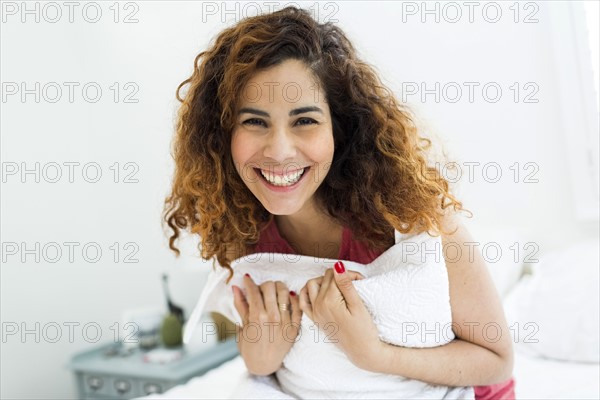 Woman holding pillow