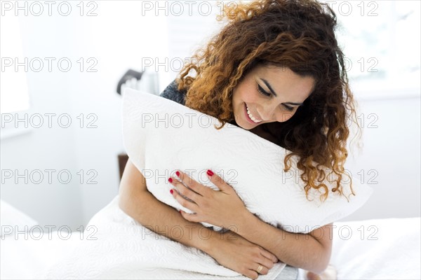 Woman holding pillow