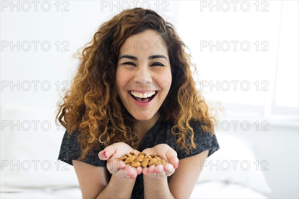 Woman holding almonds