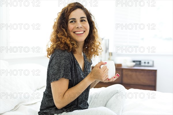 Woman holding mug