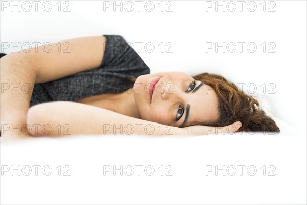 Woman lying in bed