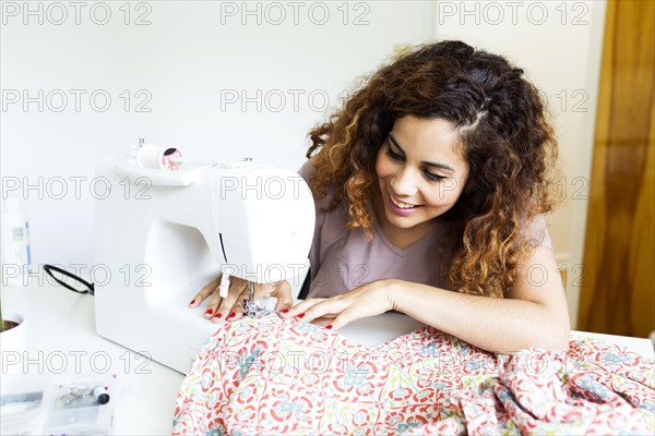 Woman using sewing machine