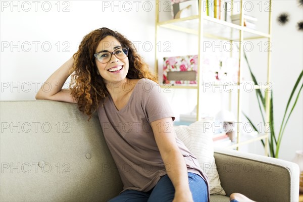 Woman sitting on sofa