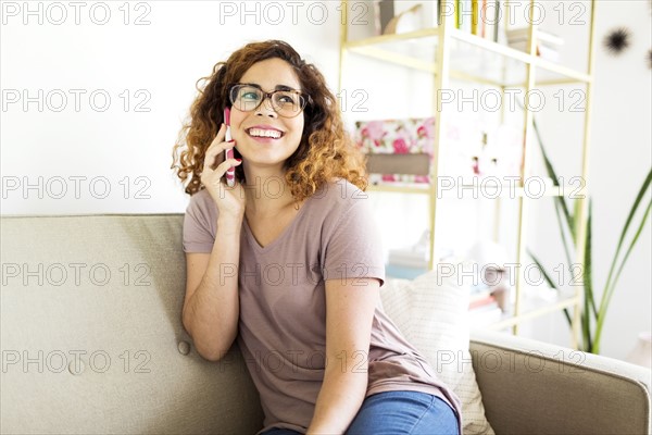 Woman sitting on sofa